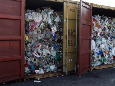 shipping container filled with garbage